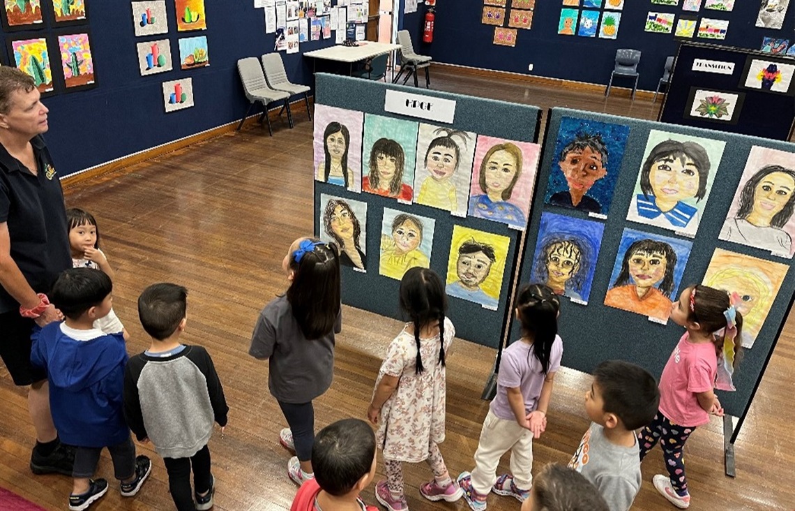 Children looking at art exhibition