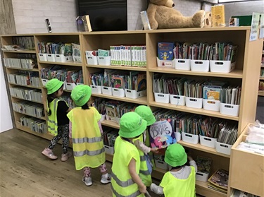 Children searching through books