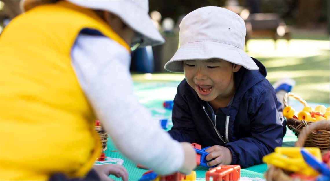 Children wearing hats playing outdoors