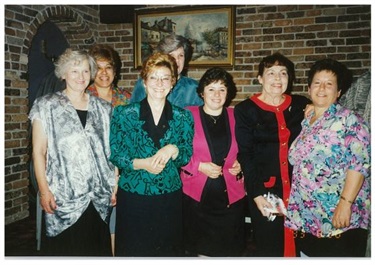 Wilma O Connor smiling and posing with group of educators