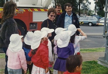 Group of young children wearing white fire fighter hats at their Fire Safety Week incursion