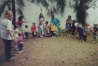 Educators preparing young children to do a balloon race