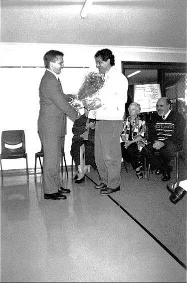 Mayor Chris Bowen receiving flowers from Family Day Care Parents Committee in 1998