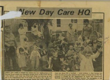 Front page of old newspaper titled New Day Care HQ with photograph of children