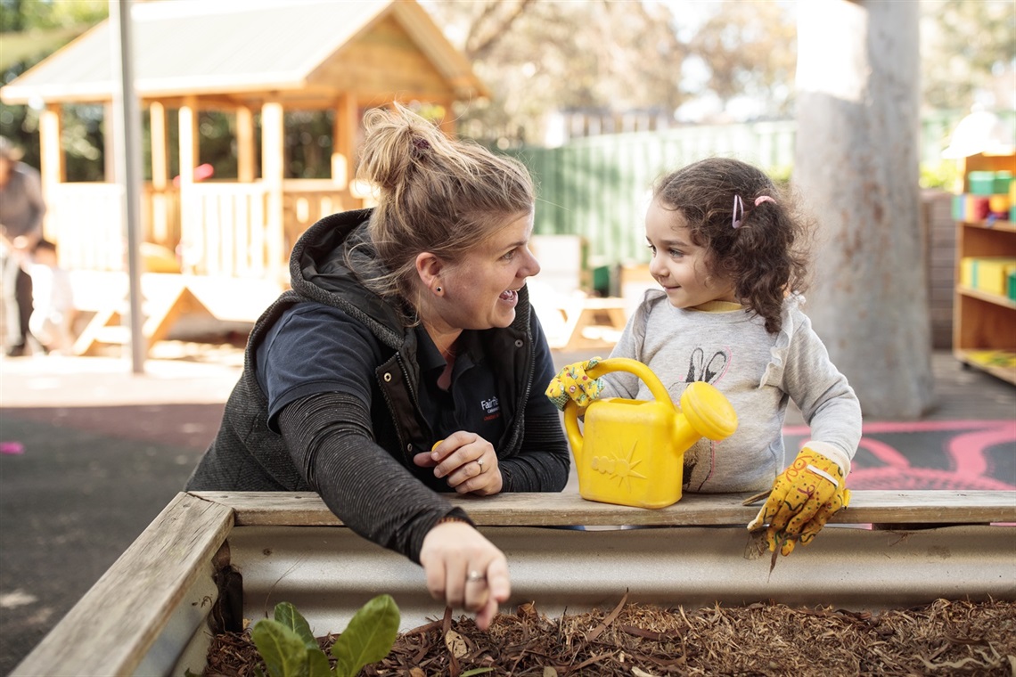 Picture of an early childhood worker with a student.